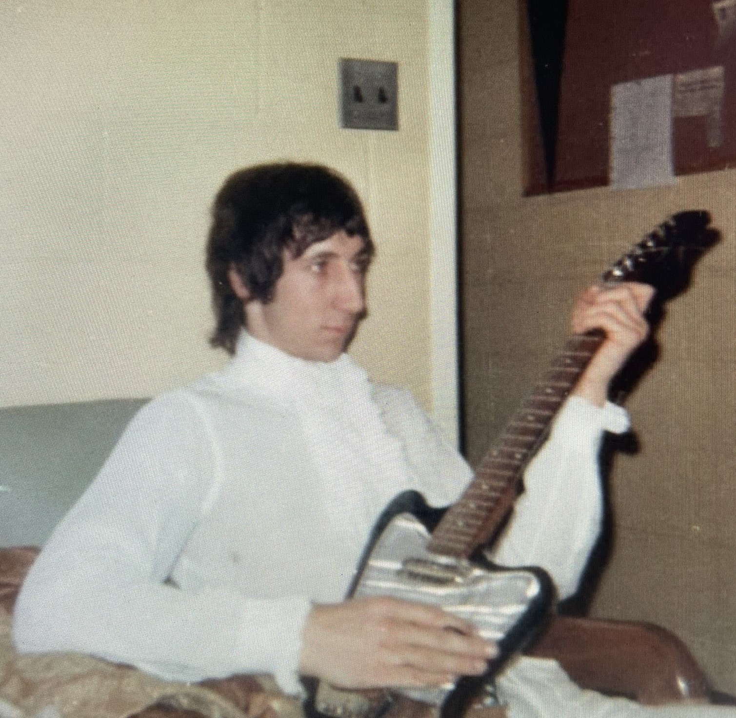 Townshend with his Cornet Hornet guitar in the teachers' lounge, used as The Who's dressing room, at Union Catholic.