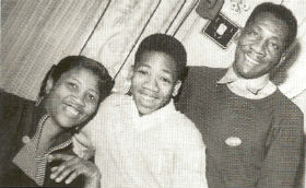 Willie with his parents Lillie and Mertis John